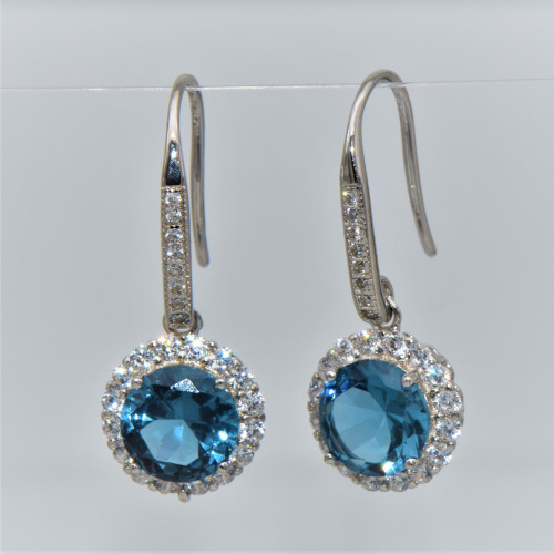 Hand made silver earrings  with round blue topaz.